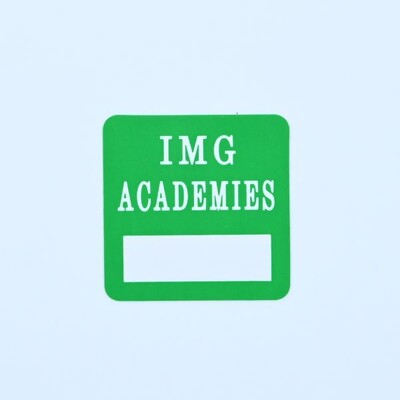 A green square sticker that reads 'IMG Academies' and has a space to write a number or name on it