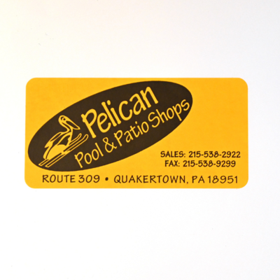 A rectangular sticker for 'Pelican Pool & Patio Shops' with their contact info