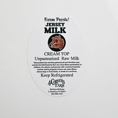 An oval sticker that's white with black text giving details and information for 'Jersey Milk Cream Top Unpasteurized Raw Milk'