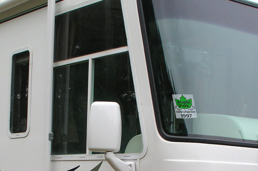 rv with campground sticker on window