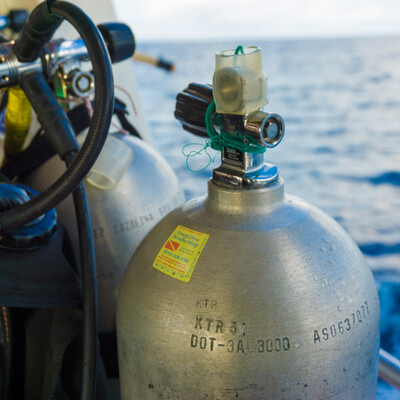 scuba tank with sticker from leland company