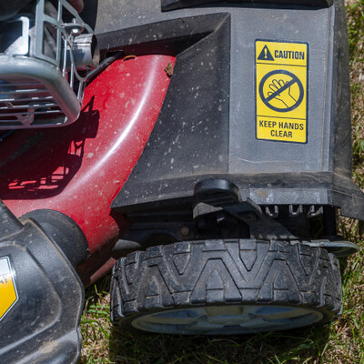 lawn mower closeup with industrial sticker