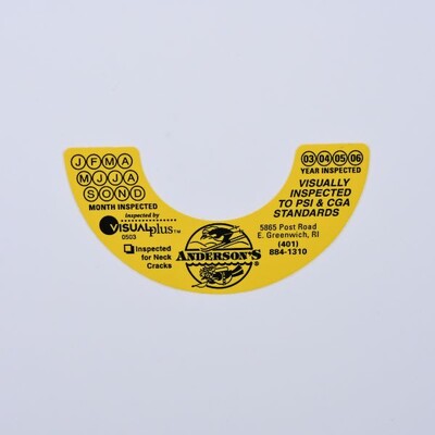 A half donut shaped sticker that is yellow with black text
