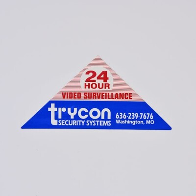 A triangular sticker that is half blue half red for Trycon Security Systems