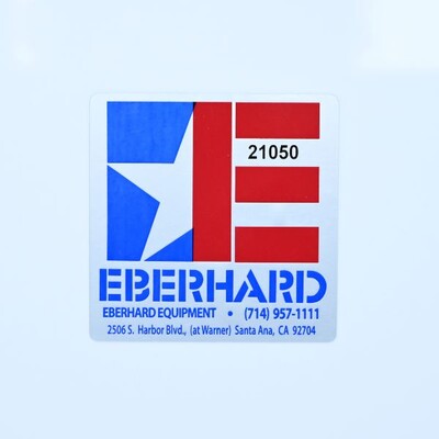 A square sticker that has a red and blue 'E' logo on with with the word 'Eberhard' underneath