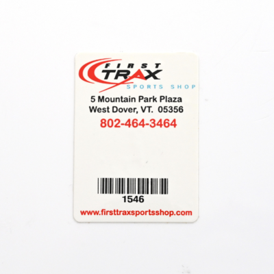 A white rectangular sticker for 'First Trax' with contact information  and a barcode and ID number at the bottom
