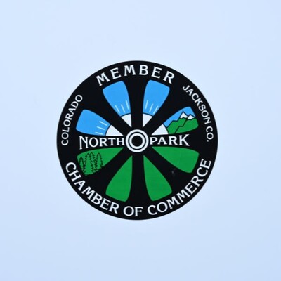 A circluar sticker that is designed to bike wheel that is for members of North Parks' Chamber of Commerce