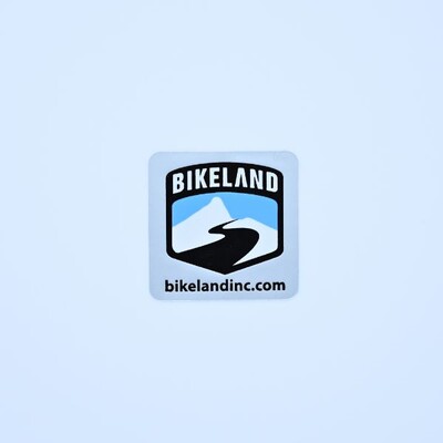 A square sticker for Bikeland that has their badge logo on it