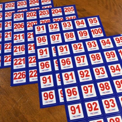 A close up of the square number ID sticker sheets
