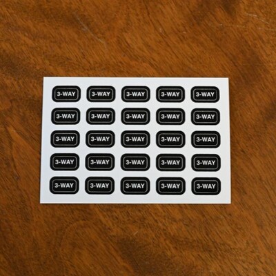 A sheet of small rounded rectangular sticker that say '3-way'
