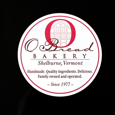 A white circular sticker for 'O Bread Bakery' 